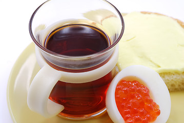 Image showing Cup of tea and caviar