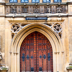 Image showing parliament in london old church door and marble antique  wall