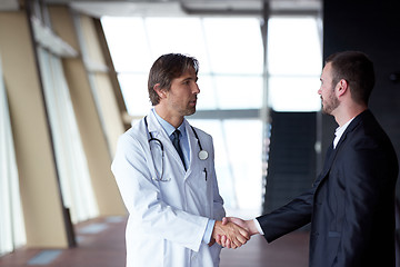 Image showing doctor handshake with a patient