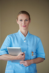 Image showing female doctor with tablet computer