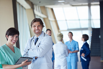 Image showing group of medical staff at hospital, handsome doctor in front of 