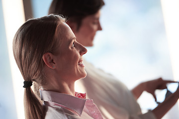 Image showing business woman working on tablet computer