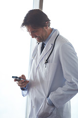 Image showing doctor speaking on cellphone