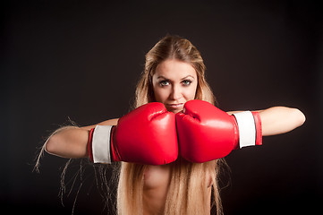 Image showing Young topless woman with boxing gloves