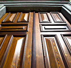 Image showing sumirago abstract    knocker in a  door curch  wood italy  lomba