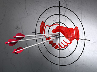 Image showing Politics concept: arrows in Handshake target on wall background