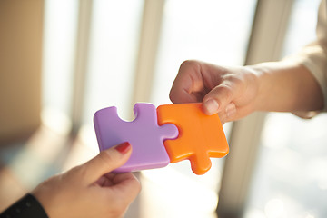 Image showing business people group assembling jigsaw puzzle