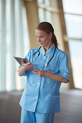 Image showing female doctor with tablet computer