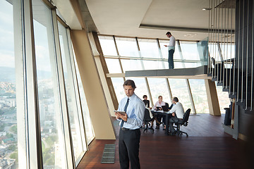 Image showing handosme business man working on tablet