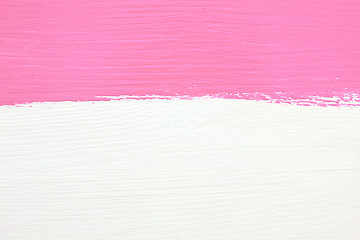Image showing Stripe of pink paint over white wooden background