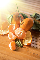 Image showing Ripe tangerines on wooden