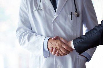 Image showing doctor handshake with a patient