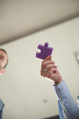 Image showing business people group assembling jigsaw puzzle