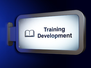 Image showing Studying concept: Training Development and Book on billboard background