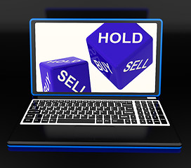 Image showing Sell And Hold Dices On Laptop Showing Strategies