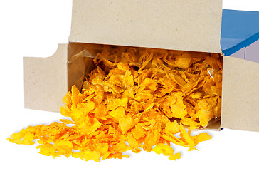 Image showing Corn flakes spill out of cardboard box
