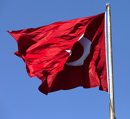 Image showing Turkish flag on flagpole waving in wind