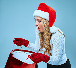 Image showing Beautiful young woman in Santa Claus clothes