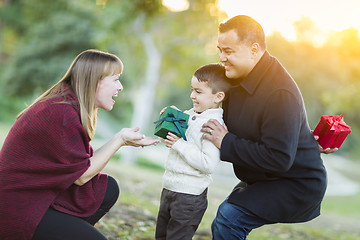 Image showing Young Mixed Race Son Handing Gift to His Mom