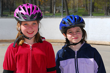 Image showing Two girls rollerblading