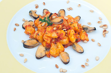 Image showing Gnocchi with tomato sauce with mussels