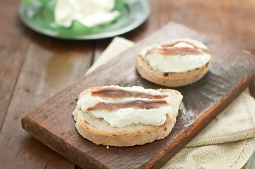 Image showing Italian bruschetta with bread calabrese, burrata cheese and anch