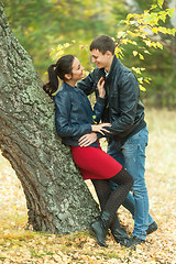 Image showing Affectionate couple taking walk in autumn park