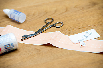 Image showing First aid kit items on wooden surface