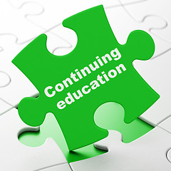 Image showing Studying concept: Continuing Education on puzzle background