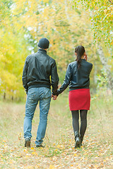 Image showing Affectionate couple taking walk in autumn park