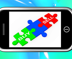 Image showing Buy And Sell Puzzles On Smartphone Shows Commerce