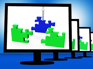 Image showing Unfinished Puzzle On Monitors Showing Strategy