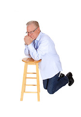 Image showing Older man kneeling and praying.