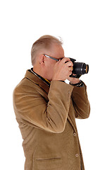 Image showing Middle age man taking pictures.