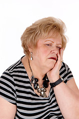 Image showing Sad looking older woman.