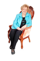 Image showing Lovely older woman in armchair.