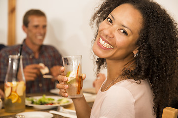 Image showing Afro-american woman having a drink