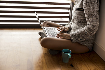 Image showing Working on the floor