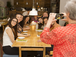 Image showing Granny taking a picture of all family