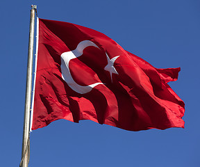 Image showing Turkish flag waving in wind at sunny day