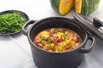 Image showing 
Soup with beans and squash with chilli powder