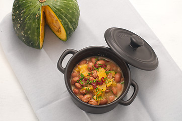 Image showing 
Soup with beans and squash with chilli powder