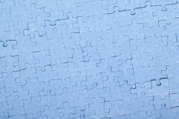 Image showing Connected blue puzzle pieces isolated