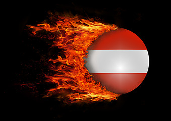 Image showing Flag with a trail of fire - Austria