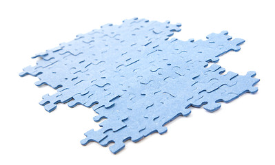 Image showing Connected blue puzzle pieces isolated