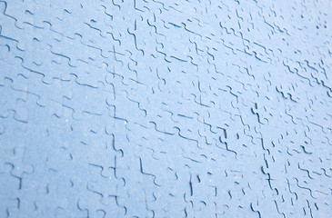 Image showing Connected blue puzzle pieces isolated