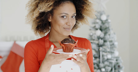 Image showing Young cook with a freshly baked Xmas cake