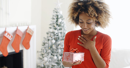 Image showing Excited young woman with an unexpected gift