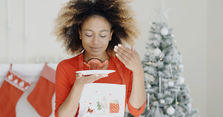 Image showing Young cook with a freshly baked Xmas cake