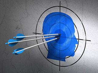 Image showing Marketing concept: arrows in Head target on wall background